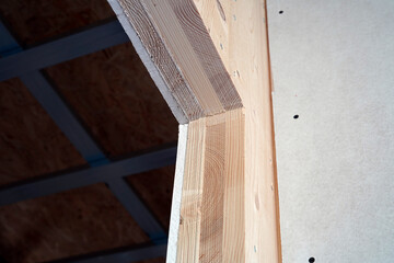 We see a detail of a massive building panel. It is solid dry wood.