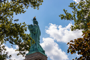 An iconic representation of freedom and independence, the Statue of Liberty with flaming torch on...