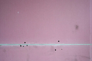Pink fireproof plasterboard.