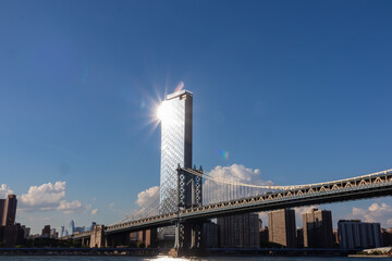 Iconic Manhattan Bridge connecting New York City's urban landscape with stunning skyline and...