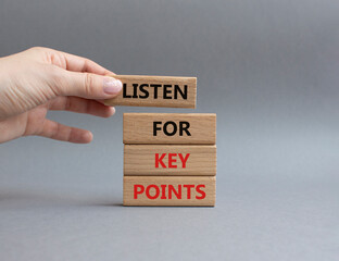 Key points symbol. Wooden blocks with words Listen for Key points. Businessman hand. Beautiful grey...