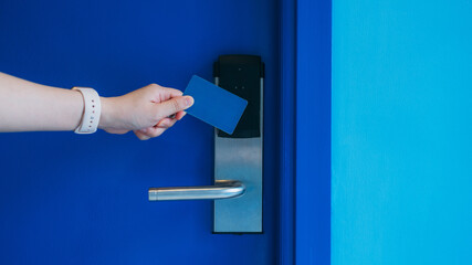 Electronic key card for unlocking hotel doors. Smart card for door access control. Concept of...