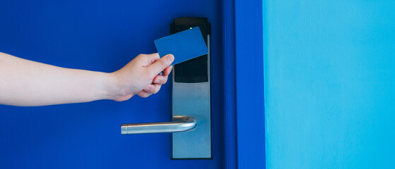 Electronic key card for unlocking hotel doors. Smart card for door access control. Concept of...