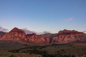 Scenic sunrise view of limestone peaks Mount Wilson, Bridge and Rainbow Mountain of Red Rock Canyon National Conservation Area in Mojave Desert near Las Vegas, Nevada, United States. Remote hiking