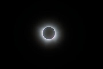 The moon completely covering the sun during solar eclipse 2024