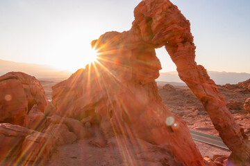 Panoramic sunrise view of the elephant rock surrounded by red and orange Aztec Sandstone Rock...