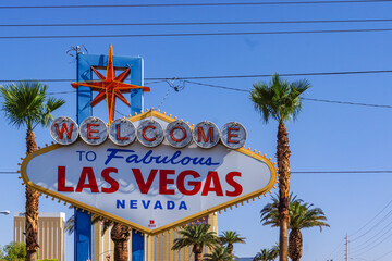 Welcome to Fabulous Las Vegas sign at daytime on Las Vegas Boulevard South (The Strip), Las Vegas, Nevada, USA. A glowing sign with illuminated text in Western script at night. Road trip in America