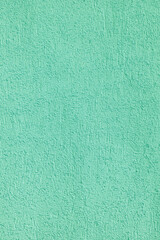 Green plastered old wall. Abstract construction background.