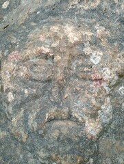 human face carved naturally on a rock