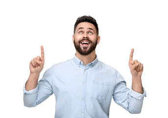 Happy young man with mustache pointing at something on white background