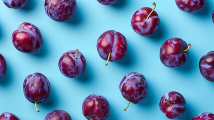 Top view of plums pattern texture blue background