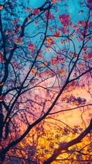 Vivid blooms contrast with the fiery hues of the setting sun, offering a frame filled with life and color dynamics