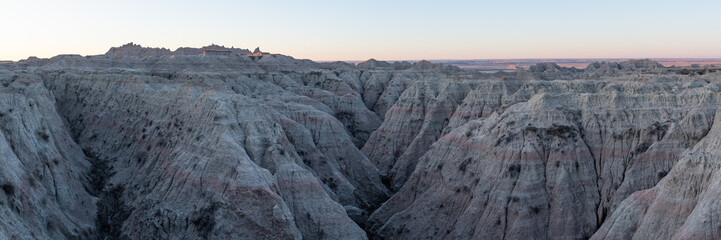 Geological Rock Formations hightlighted by the sun in the early morning hours in South Dakota's Badlands National Park in Spring