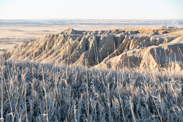 Geological Rock Formations hightlighted by the sun in the early morning hours in South Dakota's Badlands National Park in Spring