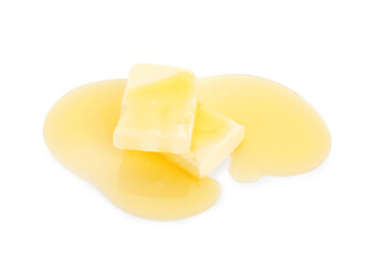 Pieces of melting butter isolated on white