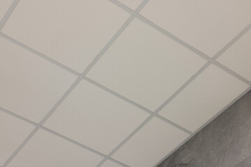 Light ceiling with PVC tiles, low angle view