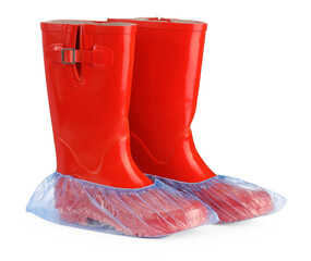 Rubber boots in blue shoe covers isolated on white