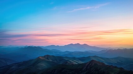 Obraz premium A tranquil scene depicting smooth mountain peaks under a sky painted with delicate twilight hues