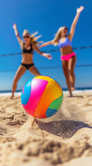 Obraz premium Beach Volleyball in the summer, volleyball closeup, blurred men, women in bikini background