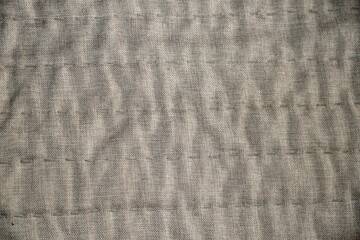 texture of beige linen quilted material