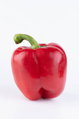Bright red sweet pepper on a white background.