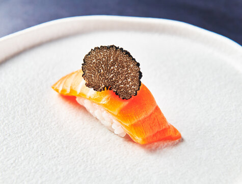Salmon roll sushi with black truffle