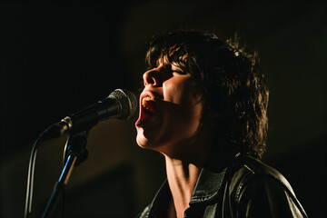 Female Singer Performing Passionately on Stage