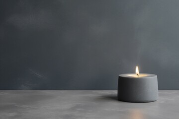 Serene minimalist candle on gray background with soft lighting