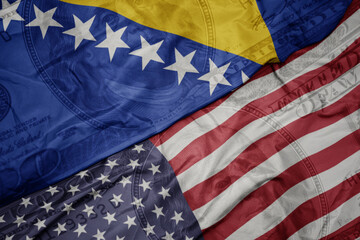 Obraz premium waving colorful flag of united states of america and national flag of bosnia and herzegovina on the dollar money background. finance concept.