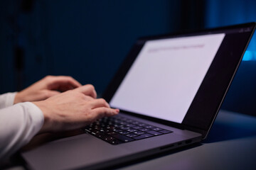 Close-up shot of female hands typing on laptop. Woman fingers tapping on computer keyboard. Work concept