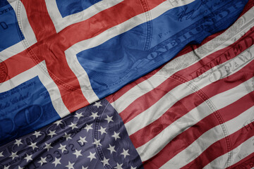 waving colorful flag of united states of america and national flag of iceland on the dollar money...