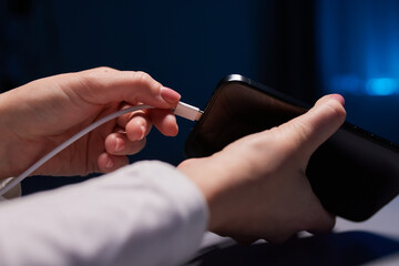 female Hand charges Charge your phone. Close up USB Type-C