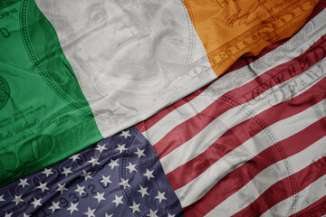 waving colorful flag of united states of america and national flag of ireland on the dollar money...