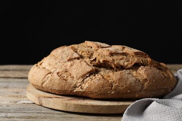 Freshly baked sourdough bread on wooden table