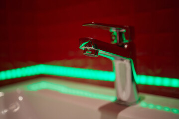 Bathroom interior with sink and faucet.