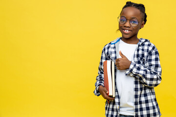 African american schoolboy in checkered shirt ready for lessons