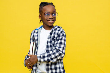 African american schoolboy in checkered shirt ready for lessons