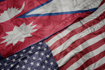 Obraz premium waving colorful flag of united states of america and national flag of nepal on the dollar money background. finance concept.