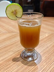 Golden Temulawak Herbal Drink in Glass, Authentic Indonesian Beverage