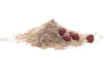 Hazelnuts ground pile and whole grains isolated on white, side view
