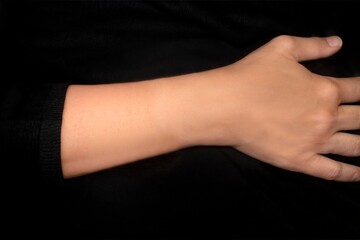Jewelry mockup arm. A woman's arm with a black sweater on, template for bracelets, watches and...