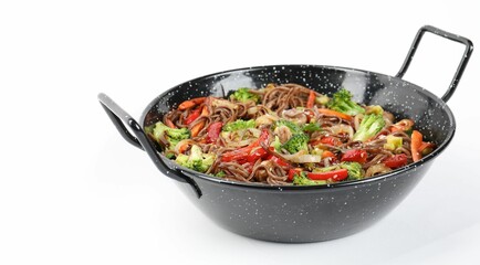 Stir-fry. Tasty noodles with meat and vegetables in wok on white background