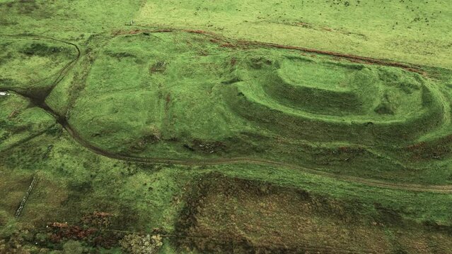 Dun Nosebridge multivalate prehistoric Iron Age fort hillfort above the River Laggan, Islay, Inner Hebrides, Scotland. Video aerial L-R looking S.E.