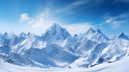 Panoramic view of snowy mountains under blue sky with white clouds