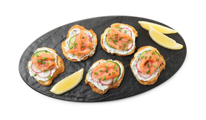 Tasty canapes with salmon, cucumber, radish and cream cheese isolated on white, top view