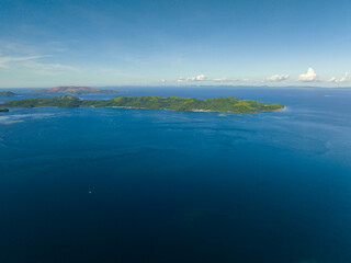 Aerial view of tropical island and blue sea. Mindanao, Philippines. Seascape.