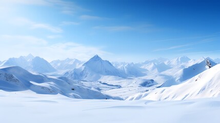 Panorama of snow-capped mountains and blue sky in winter
