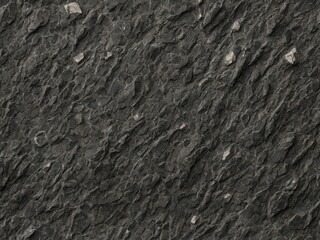 Intricate details of dark gray rock surface. Rock face characterized by rough texture, with numerous cracks, crevices of varying sizes creating uneven, rugged appearance. Small.