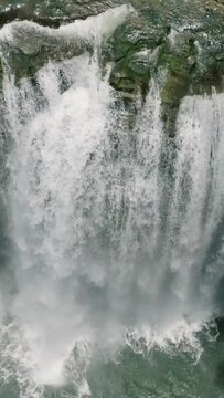 Top view of water curtain-like in Tinuy-an Falls. Mindanao, Philippines. Slow Motion. Vertical view.