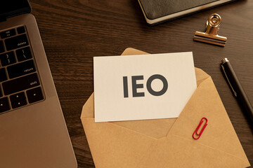 There is word card with the word IEO. It is an abbreviation for Initial Exchange Offering as...